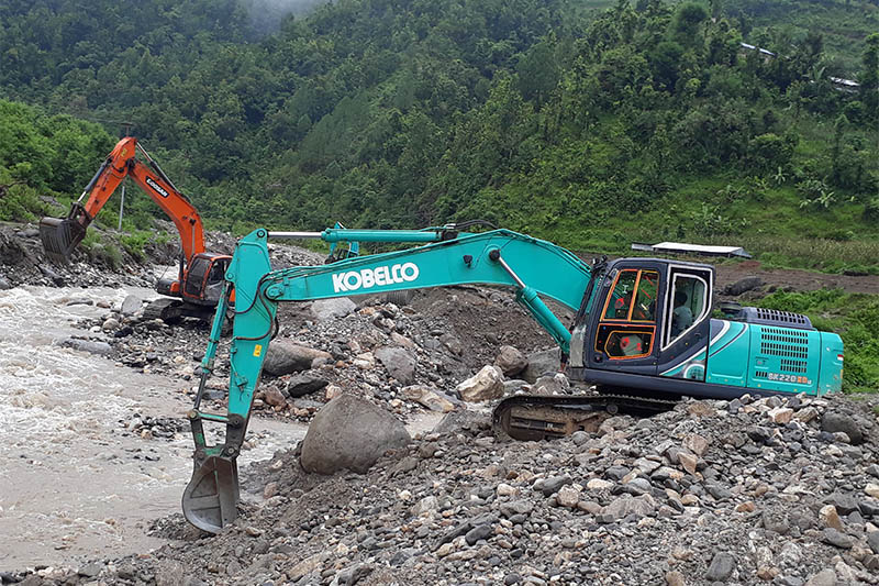 Skyvators being used for extraction of sand and other items from river in Dhading district, on Wednesday, July 31, 2019. Photo: Keshav Adhikari/THT