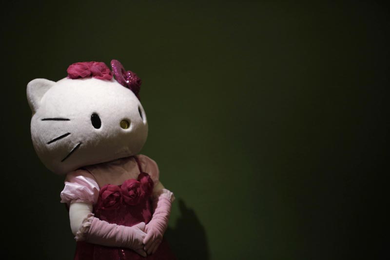 FILE - In this Thursday, October 30, 2014 file photo, a model dressing as Japanese character Hello Kitty waits for guests to pose for a souvenir photo at Sanrio Puroland, a theme park featuring Hello Kitty in Tokyo. Photo: AP