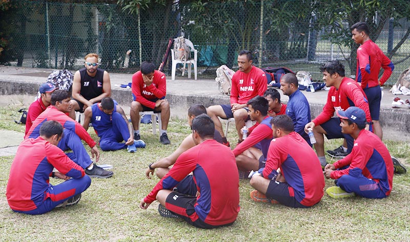Nepal national cricket team members listen to coach Umesh Patwal (second from left) during a training session in Singapore on Friday, on the eve of their ICC World Twenty20 Asia Region Final match against Kuwait. Photo courtesy: CricketingNepal