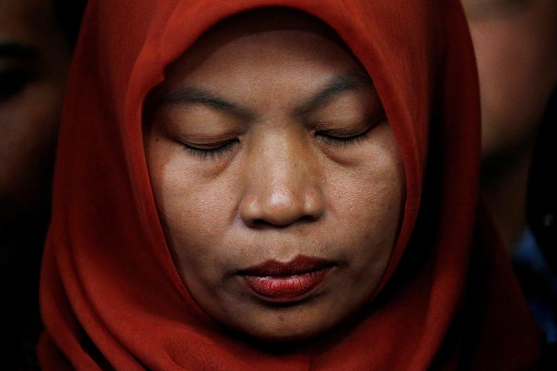 Baiq Nuril Maknun, a teacher on the island of Lombok who was jailed after she tried to report sexual harassment, reacts during a press conference with Indonesia's Law and Human Rights Minister Yasonna Laoly in Jakarta, Indonesia, July 8, 2019. Photo: Reuters