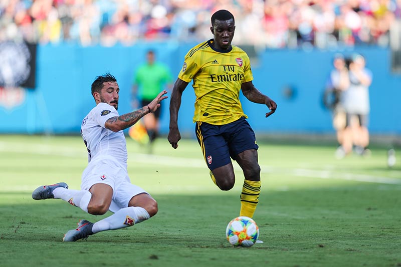 Fiorentina defender Federico Ceccherini (5) tries to slide under for the steal under Arsenal side Eddie Nketiah (30)during the International Champions Cup soccer series at Bank of America Stadium, in Charlotte, NC, USA, on July 20, 2019. Photo:Jim Dedmon-USA TODAY Sports via Reuters
