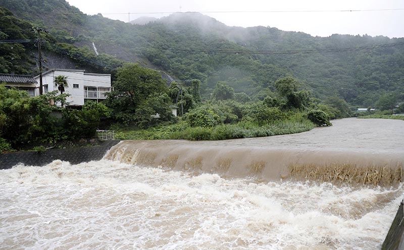 The Futami River is swollen due to heavy rain in Yatsushiro, Kumamoto Prefecture, southwestern Japan, July 3, 2019. Photo: Kyodo via Reuters