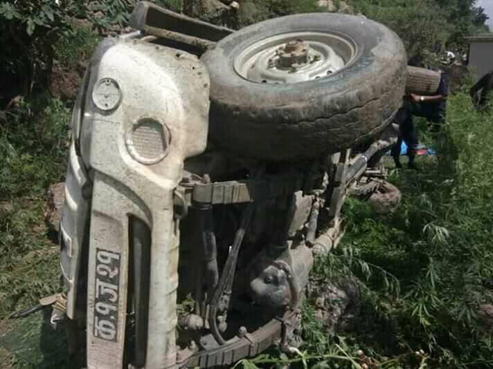 A jeep overturned on its side in Bhuwa Khola, Jagannath Rural Municipality-5 of Bajura district, on Friday, July 19, 2019. The vehicle reversed on inclined rough road and plunged 50 metres killing two passengers including the driver and injuring 12 others. Photo: Prakash Singh/THT
