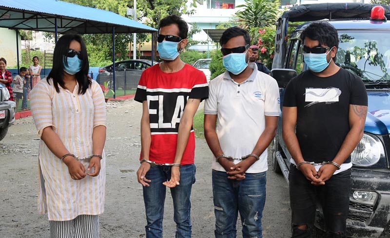 Police making public four persons arrested for honey-trapping, in Jhapa, on Tuesday, July 23, 2019. Photo: THT