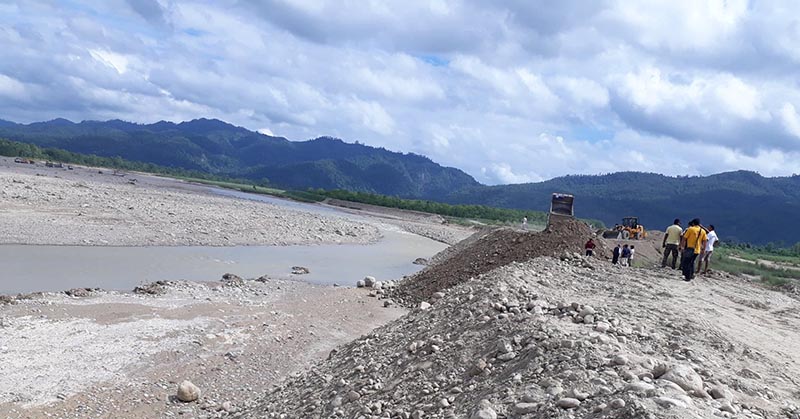 Excavators being used to repair the enbankment damaged by flood in the Lalbakaiya River in Nijgadh Municipality, Bara, on Tuesday, July 30, 2019. Photo: Prabhat Kumar Jha/THT