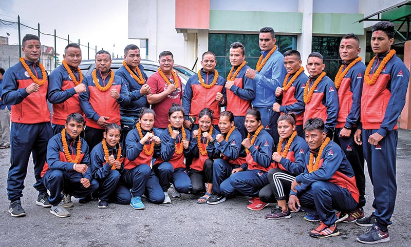 Nepal boxing team members pose for a group photo at a farewell programme in Lalitpur on Sunday. Photo: THT