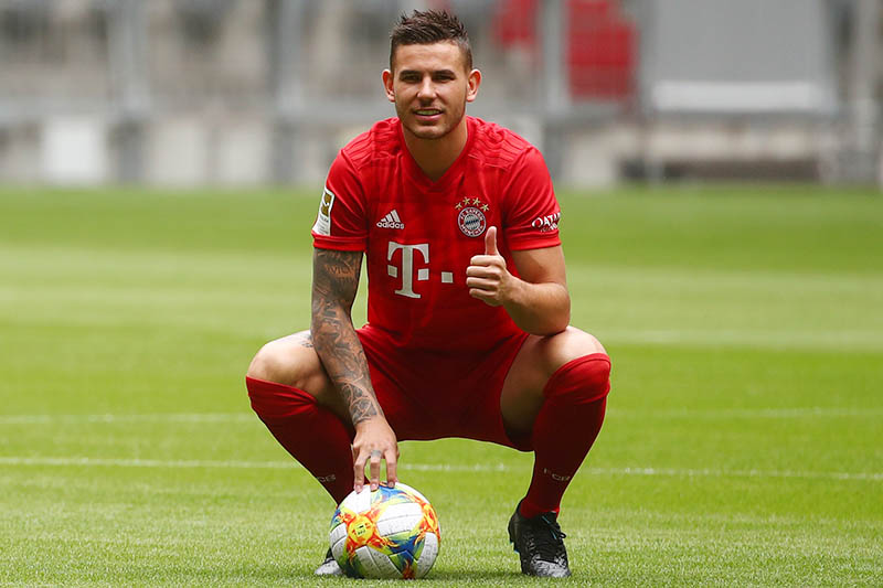 Lucas Hernandez poses for a photograph during the unveiling. Photo: Reuters