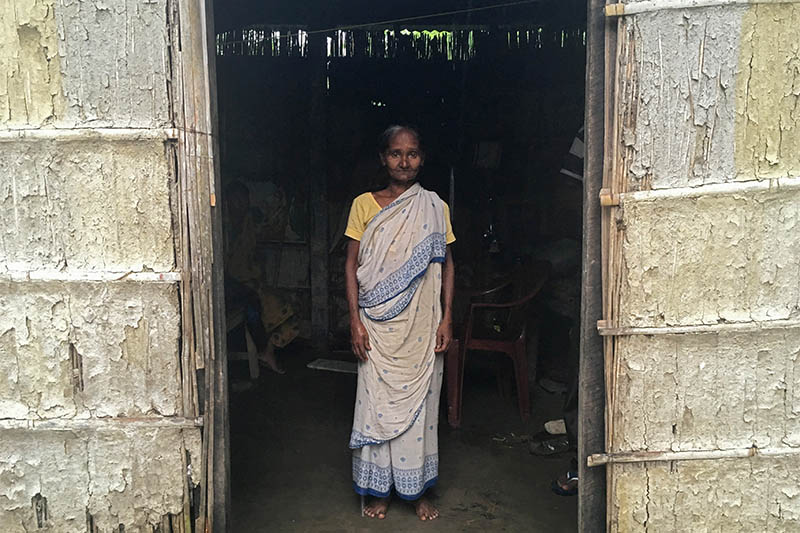 Madhubala Mandal, 59, poses for a photograph inside her bamboo hut in Bishnupur village in the northeastern state of Assam, India, July 10, 2019. Photo: Reuters