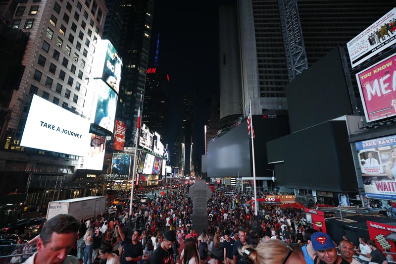 Screens in Times Square are black during a power outage, Saturday, July 13, 2019, in New York. Photo: AP