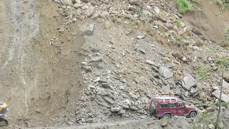 A jeep is seen stranded in a landslide-hit area along Phidim-Ilam road section of the Mechi Highway, on Thursday, July 18, 2019. Photo: Laxmi Gautam/THT