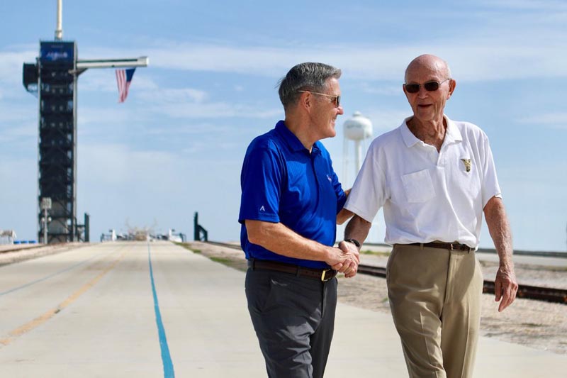 In this Tuesday, July 16, 2019 photo made available by NASA, astronaut Michael Collins, right, speaks to Kennedy Space Center Director Bob Cabana at Launch Complex 39A, about the moments leading up to launch at 9:32 am on July 16, 1969, and what it was like to be part of the first mission to land on the moon. Photo: NASA via AP