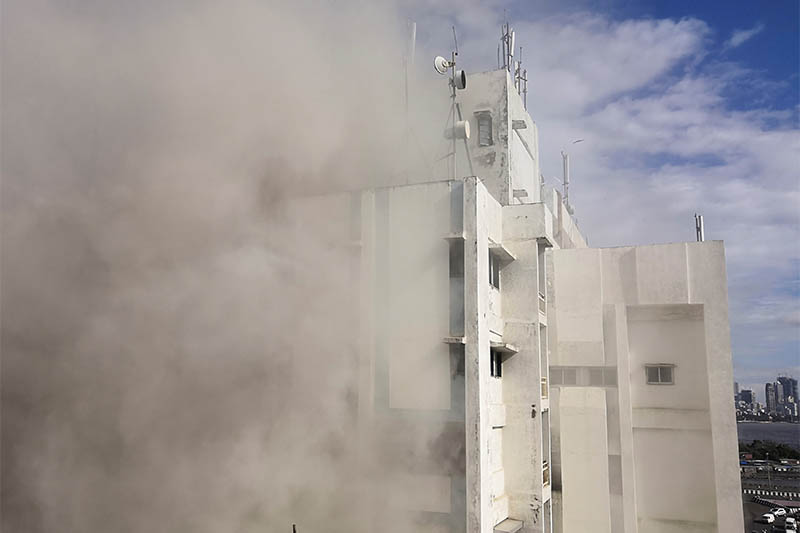 Smoke is seen coming out of a Mahanagar Telephone Nigam Limited (MTNL) building after a fire broke out, in Mumbai, India, on Monday, July 22, 2019. Photo: Reuters
