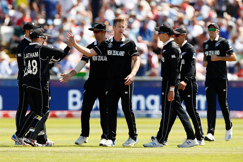 New Zealand's James Neesham celebrates with team mates after taking the wicket of England's Chris Woakes not in picture. Courtesy: Reuters