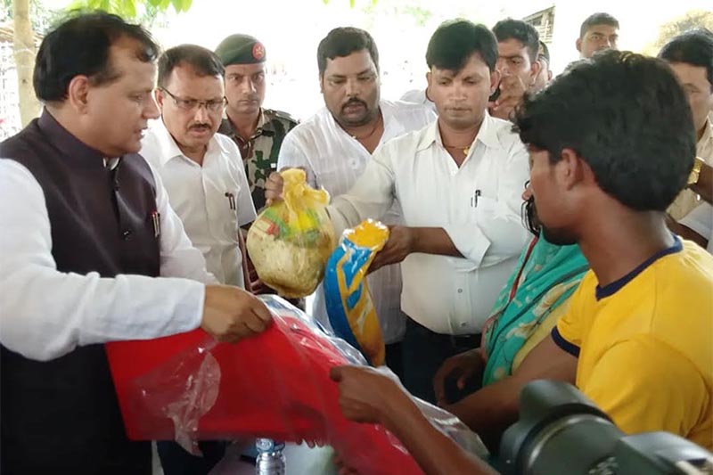 Province 2 Chief Minister Lal Babu Raut distributing relief materials to families of those who were killed in floods, in District Administration Office, Rautahat, on Thursday, July 18, 2019. Photo: THT