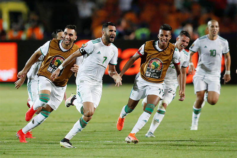 Algeria's Riyad Mahrez celebrates scoring their second goal with teammates. Photo: Reuters