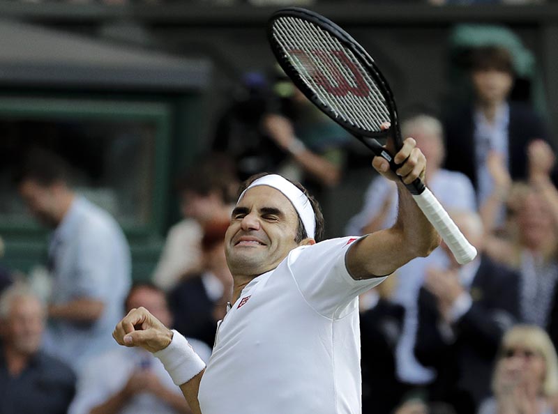Switzerland's Roger Federer celebrates defeating Spain's Rafael Nadal during a men's singles semifinal match on day eleven of the Wimbledon Tennis Championships in London, Friday, July 12, 2019. Photo: AP