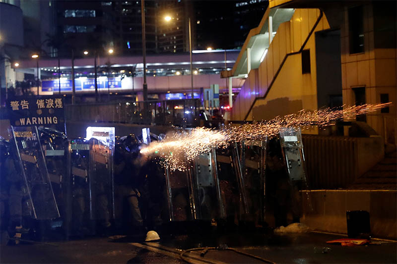 Riot police fire tear gas at demonstrators during a protest against police violence in Hong Kong, China July 28, 2019. Photo: Reuters