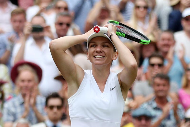 Romania's Simona Halep celebrates winning the Wimbledon final against Serena Williams of the US, at All England Lawn Tennis and Croquet Club, in London, Britain, on July 13, 2019. Photo: Reuters