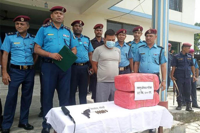 The suspect being made public along with the seized arms, drugs at District Police Office, Makwanpur, in Hetauda, on Sunday, July 21, 2019. Photo: Prakash Dahal/THT
