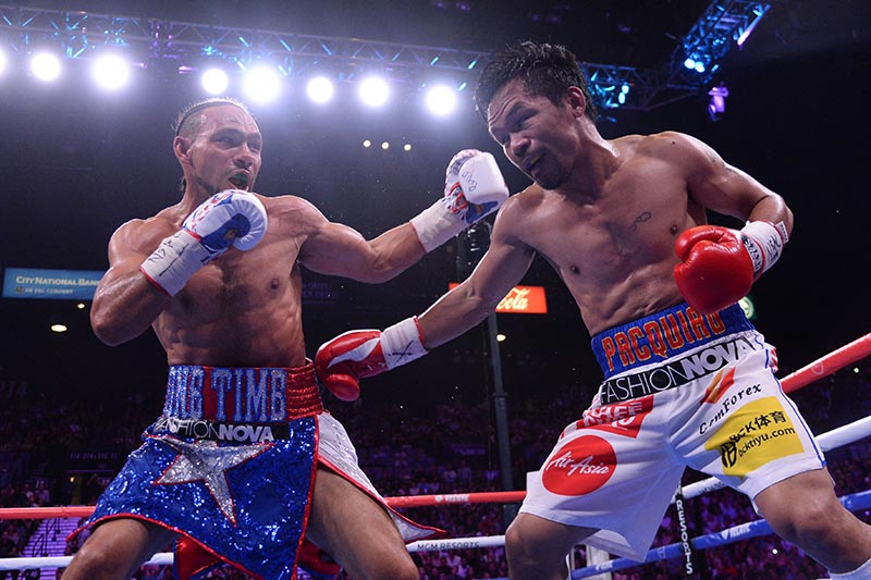 Manny Pacquiao (white trunks) and Keith Thurman (red/white/blue trunks) box during their WBA welterweight championship bout at MGM Grand Garden Arena, in Las Vegas, NV, USA, on July 20, 2019. Photo: Joe Camporeale-USA TODAY Sports via Reuters
