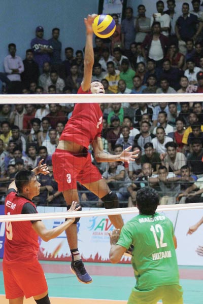 Hari Bahadur Adhikari jumps to attempt a spike shot against Madlives during the AVC Asian Senior Men's Central Zone Volleyball Championship match between Nepal and Maldives at the Nepali Army Sports Complex in Lagankhel in Lalitpur on Wednesday, August 21,2019. Photo: Udipt Singh Chhetry/THT