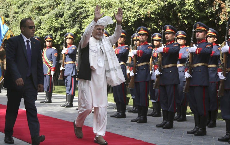Afghanistan's President Ashraf Ghani, centre, greets as he arrives to offer Eid al-Adha prayers at the presidential palace in Kabul, Afghanistan, Sunday, August 11, 2019. Photo: AP