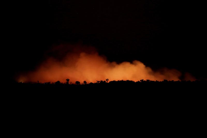 Smoke billows during a fire in an area of the Amazon rainforest near Humaita, Amazonas State, Brazil on Saturday, August 17, 2019. Photo: Reuters