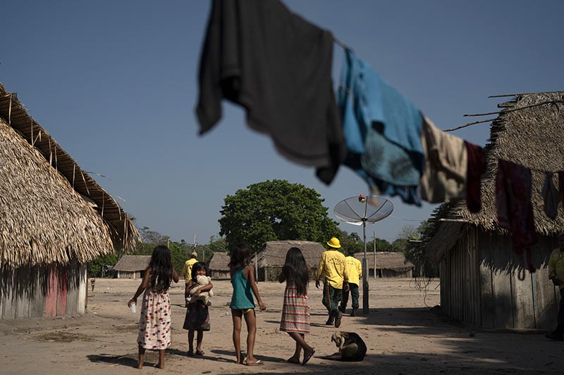 Kayapo indigenous members stand near their shelters in the Bau indigenous reserve in Altamira, in Brazil's Amazon on August 27, 2019. Photo: AP