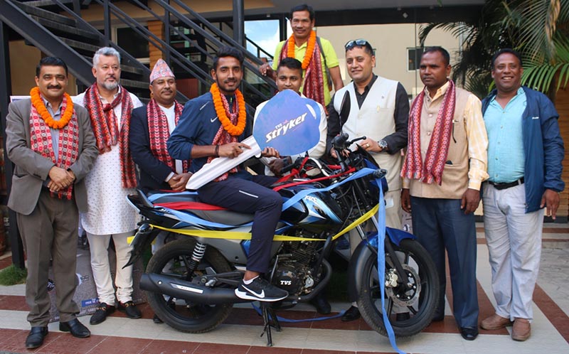 Athlete Ajit Kumar Yadav poses for a photo with officials after a felicitation programme in Kathmandu on Friday, August 9, 2019. Photo: THT