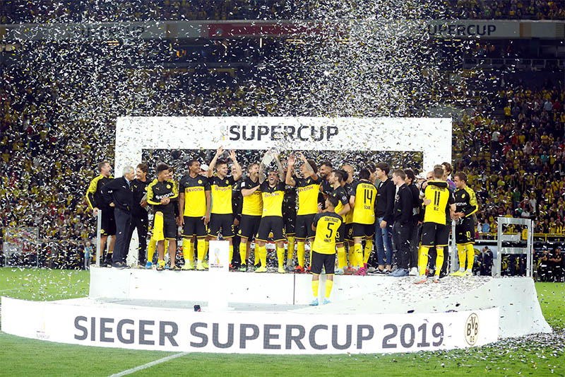 Borussia Dortmund celebrate with the trophy after winning the German Super Cup. Photo: Reuters