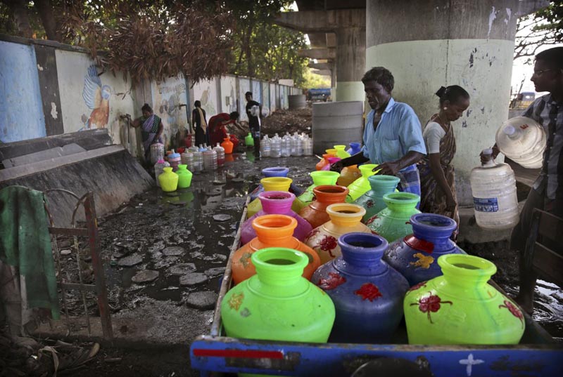 File - People fill drinking water at a water filling depot in Chennai, capital of the southern Indian state of Tamil Nadu, on Monday, July 15, 2019. Photo: AP