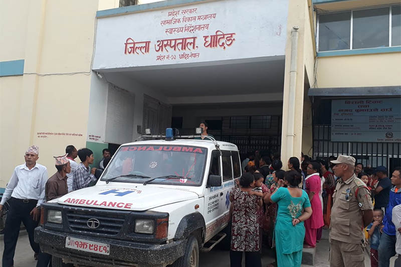 Locals gather around the District Hospital after a jeep accident in the area, on Tuesday, August 13, 2019. Photo: Keshav Adhikari/THT