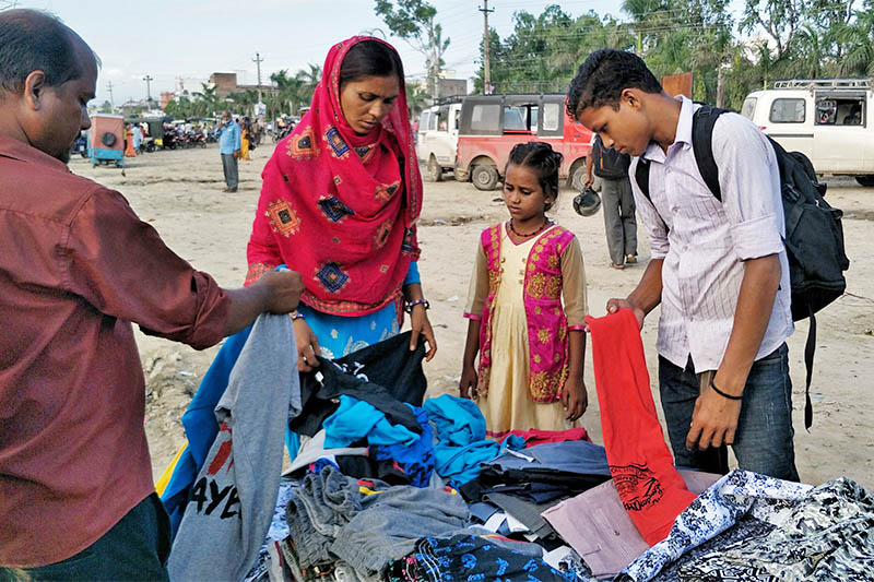 A street vendor displays clothes to customers a day before Eid al-Adha festival, widely celebrated by the Muslim communities across the globe tomorrow, in Birgunj Metropolitan City, on Sunday, August 11, 2019. Photo: Ram Sarraf/THT