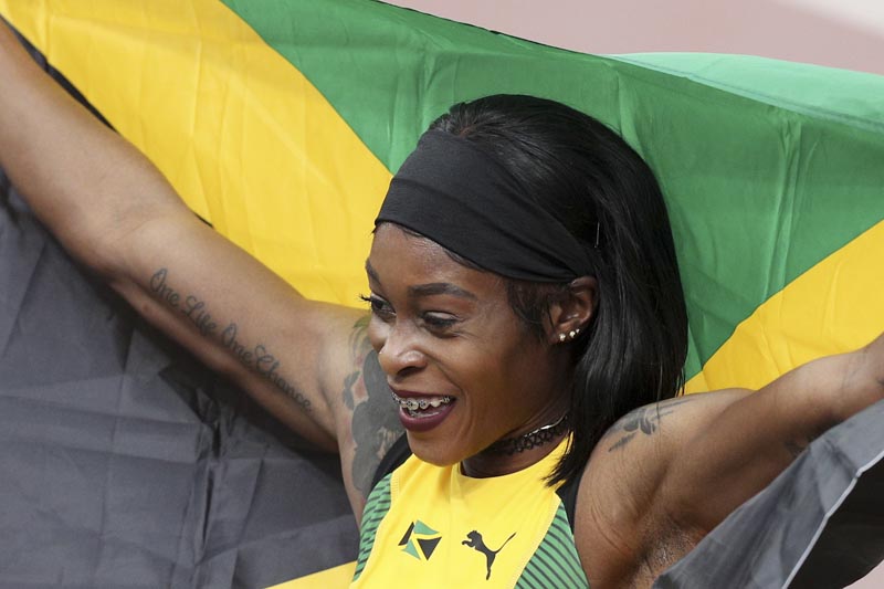 Elaine Thompson ofu00a0Jamaica celebrates winning the gold medal in the women's 100m during the athletics at the Pan American Games in Lima, Peru, Wednesday, August 7, 2019. Photo: AP