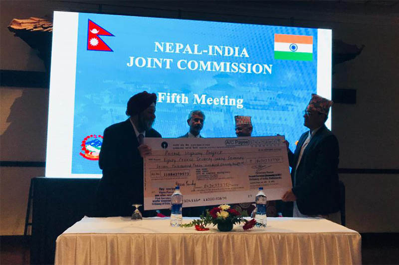 Indian Ambassador to Nepal Manjeev Singh Puri on behalf of the Government of India hands over a cheque equivalent to INRs 807,077,979 to the Government of Nepal during the fifth Nepal-India Joint Commission meeting, in Kathmandu, on Wednesday, August 21, 2019. Photo courtesy: Indian Embassy, Kathmandu Twitter
