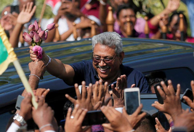 FILE-Sri Lanka's former defence secretary Gotabaya Rajapaksa (C) gestures at his supporters after he returned from United States of America (USA) in Katunayake, Sri Lanka April 12, 2019. Photo: Reuters