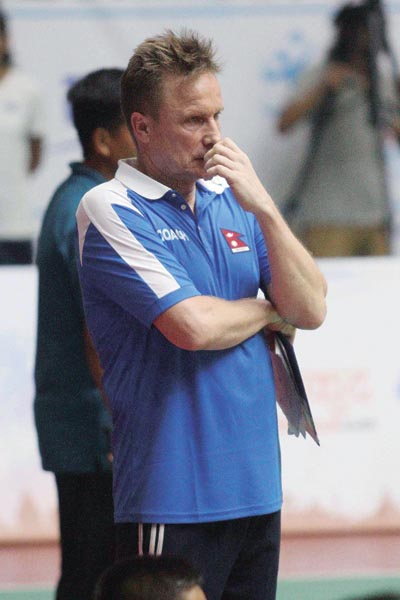 Nepal national volleyball team head coach Hann Abing looks dejected; action in the match between Nepal (left) and the Maldives, during the AVC Asian Senior Mens Central Region Volleyball Championship in Lalitpur on Wednesday, August 21, 2019.Photo: Udipt Singh Chhetry/THT