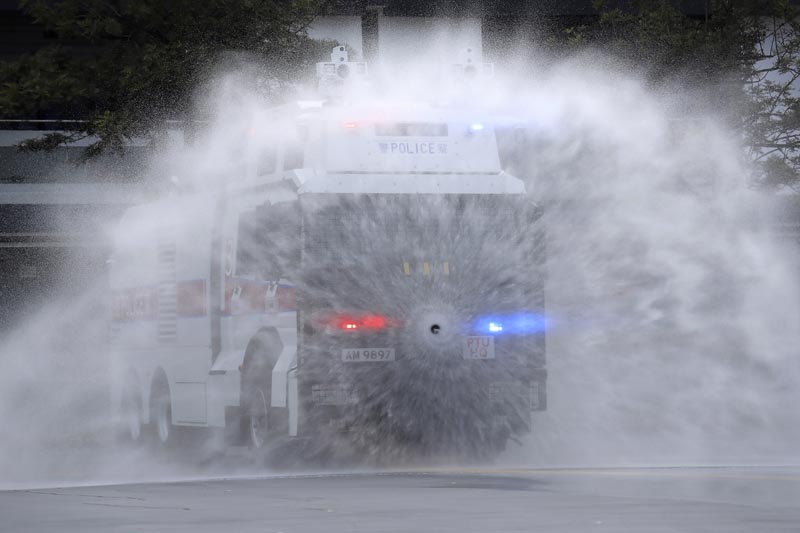 An anti-riot vehicle equipped with water cannon shows its water spraying skill during a demonstration at the Police Tactical Unit Headquarters in Hong Kong, Monday, August 12, 2019. Photo: AP