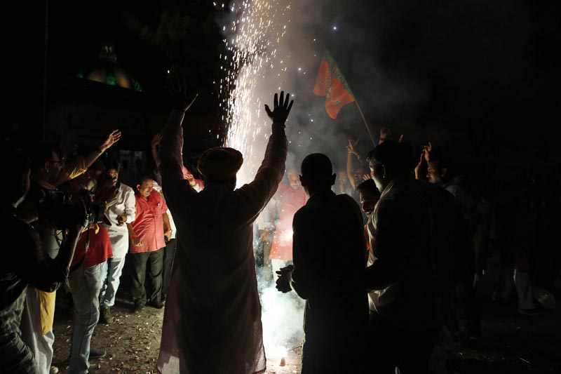 Supporters of India's ruling Bharatiya Janata Party (BJP) light firecrackers and celebrate the government revoking Kashmir's special status, in Lucknow, India, Tuesday, August 6, 2019. Photo: AP