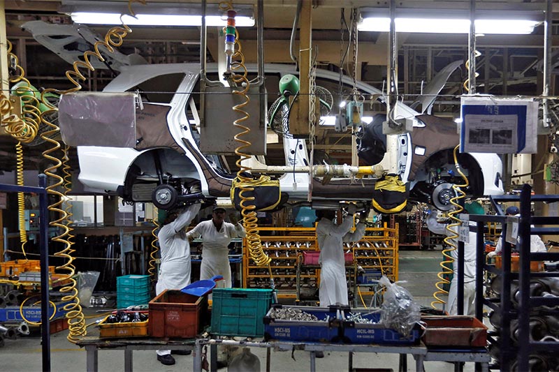 FILE - Employees work at the production line on a Honda Mobilio car at a Honda plant in Greater Noida on the outskirts of New Delhi July 21, 2014. Photo: Reuters