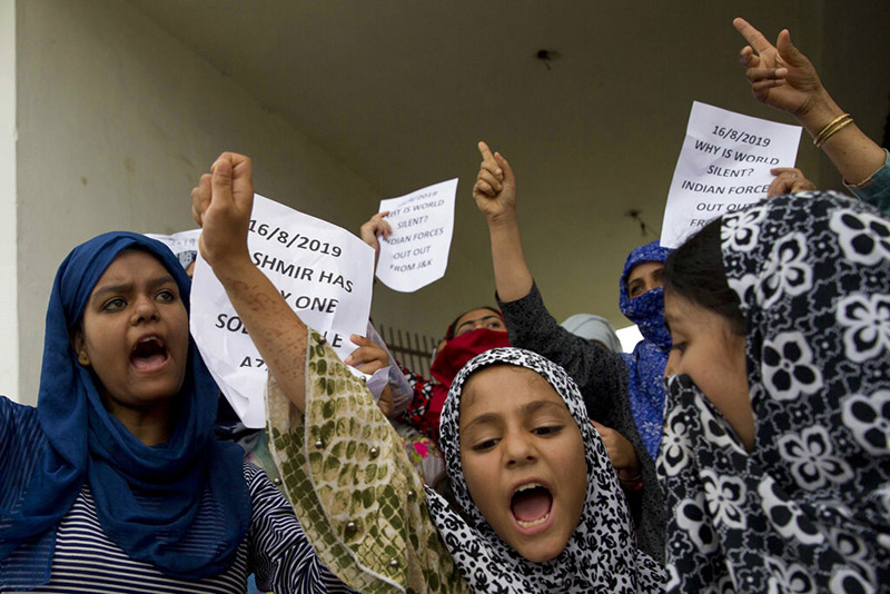 Kashmiri Muslim girls shout pro-freedom slogans during a demonstration after Friday prayers amid curfew like restrictions in Srinagar, India, on Friday, August 16, 2019. India's government assured the Supreme Court on Friday that the situation in disputed Kashmir is being reviewed daily and unprecedented security restrictions will be removed over the next few days, an attorney said after the court heard challenges to India's moves. Photo: AP