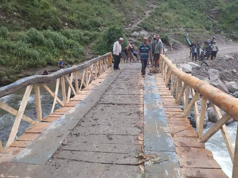 A view of the wooden bridge over Malagaad river, in Triveni Municipality, of Bajura district. Photo: Prakash Singh/THT