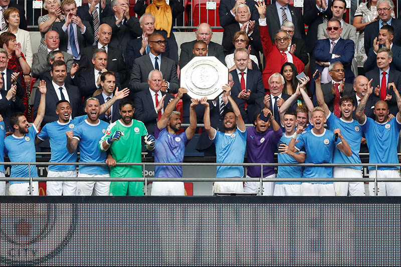 Manchester City's Sergio Aguero and David Silva celebrate winning the FA Community Shield with team mates. Photo: Reuters