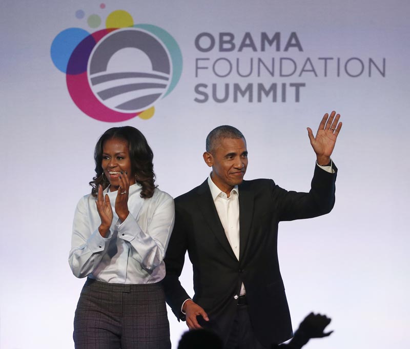 FILE - In this October 13, 2017 file photo, former President Barack Obama (right) and former first lady Michelle Obama arrive for the first session of the Obama Foundation Summit in Chicago. Photo: AP
