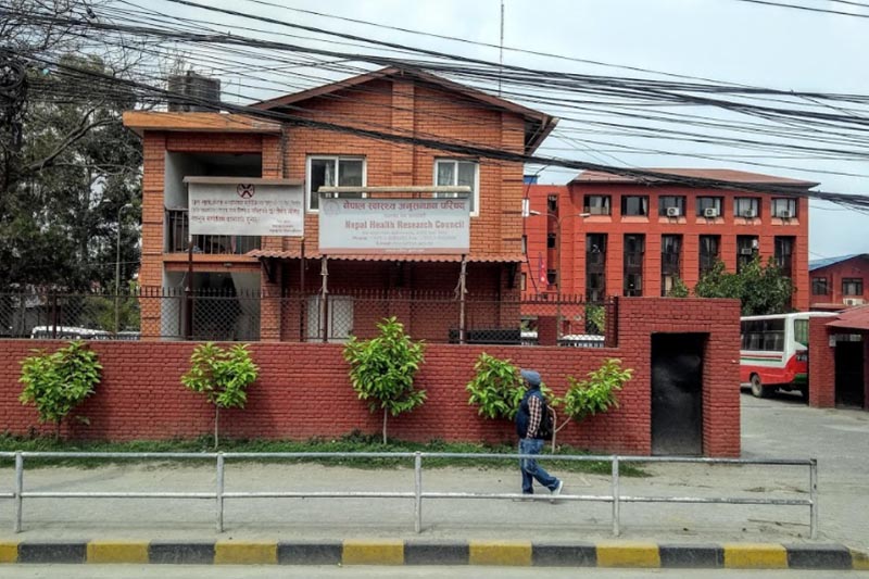 A man walks past the building of Nepal Health Research Council, near Bhadrakali, in Kathmandu. Photo courtesy: Carole Beausoleil