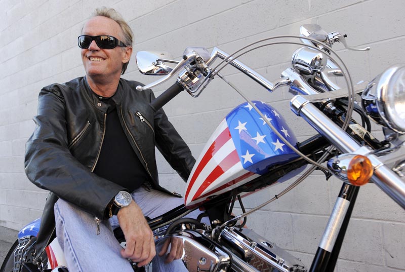 Peter Fonda, poses atop a Harley-Davidson motorcycle  in Glendale, California, Friday, October 23, 2009. Photo: AP/File