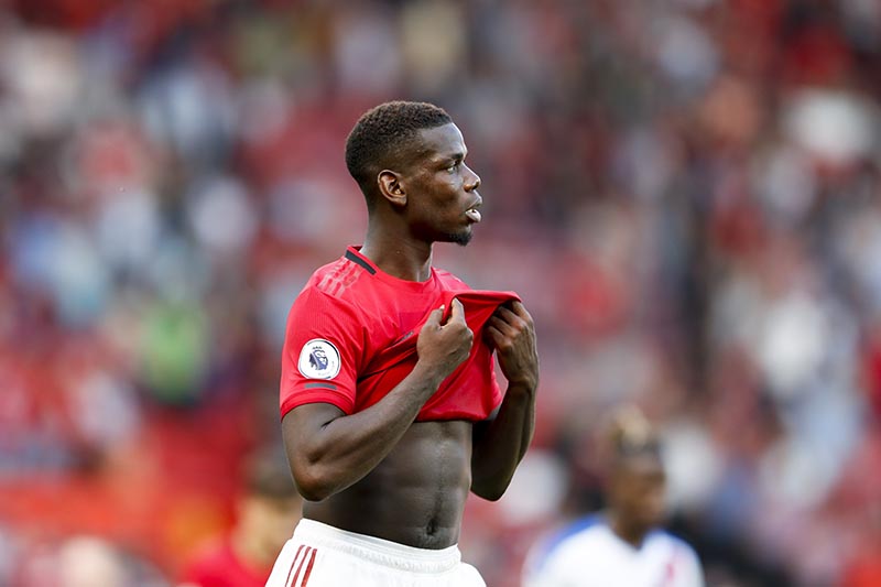 Manchester United's Paul Pogba leaves the pitch at the end of the English Premier League soccer match between Manchester United and Crystal Palace at Old Trafford in Manchester, England, on Saturday, August 24, 2019. Photo: AP