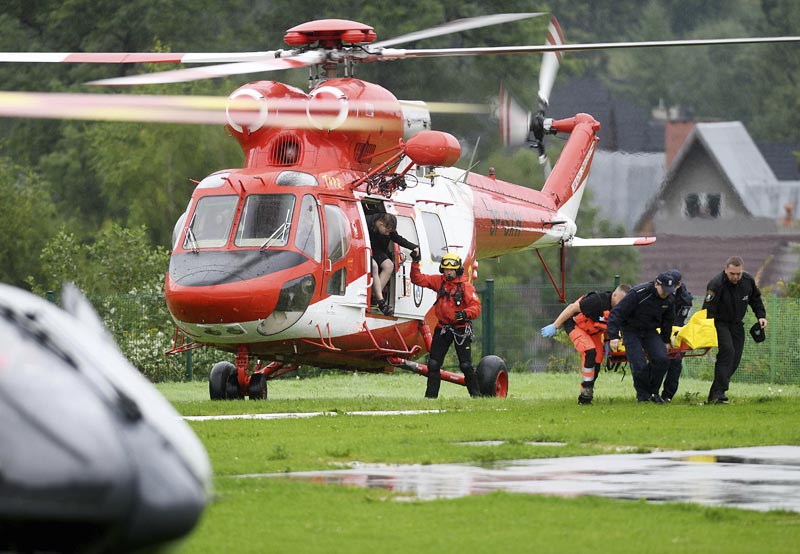 Rescue helicopter have brought to hospital the first people injured by a lighting that struck in Poland's southern Tatra Mountains during a sudden thunderstorm, in Zakopane, Poland, on Thursday, August 22, 2019. Photo: AP