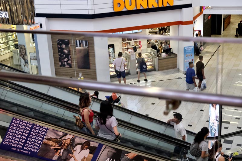 In this August 7, 2019, photo shoppers ride an escalator inside the Glendale Galleria in Glendale, California.Photo: AP