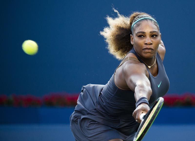 Serena Williams, of the United States, returns the ball to Ekaterina Alexandrova, of Russia, during the Rogers Cup womenu0092s tennis tournament on Thursday, August 8, 2019, in Toronto. Photo: Nathan Denette/The Canadian Press via AP